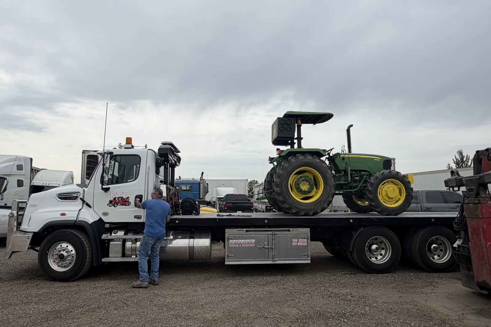 Farm tractor loaded on a flat deck