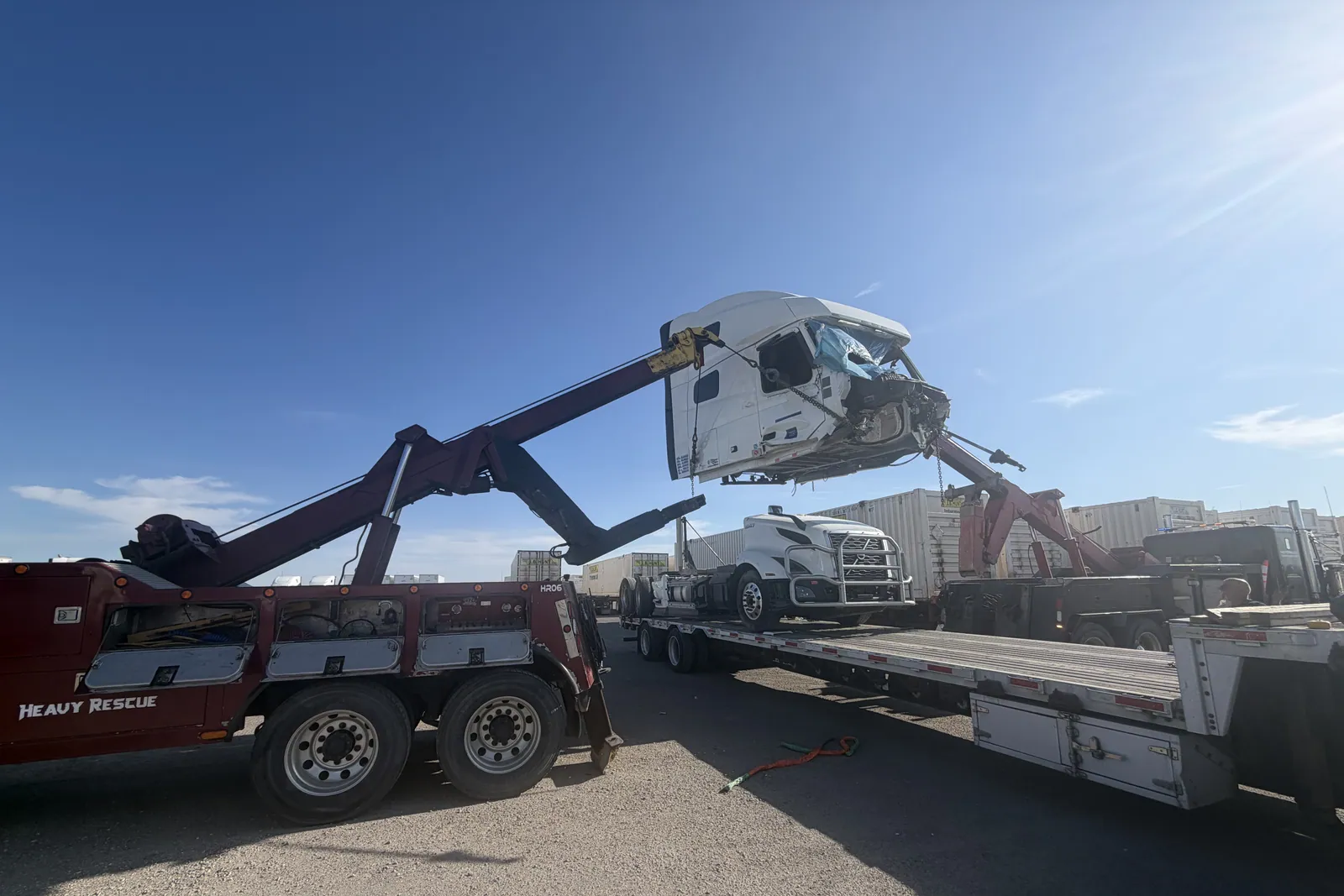 Notorious Towing heavy wrecker lifting a damaged cab